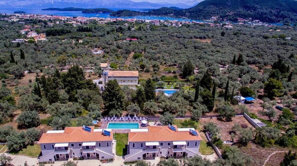 an aerial view of a house with a swimming pool at Golden Sun Villas in Nydri