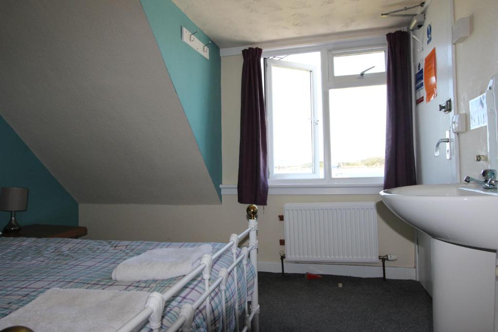 Postel nebo postele na pokoji v ubytování Skye Backpackers