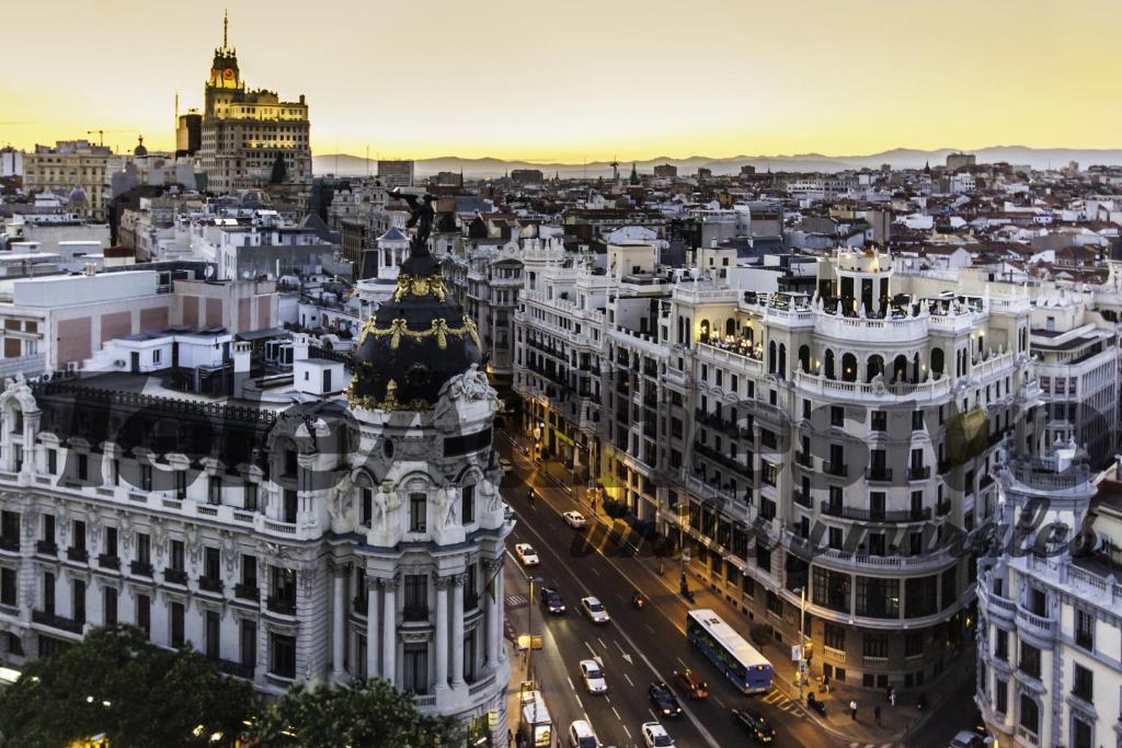 an aerial view of a city at night at M&F Apartaments Gran Via in Madrid