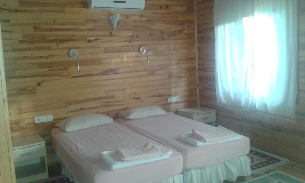 Postel nebo postele na pokoji v ubytování Bungalow Halil