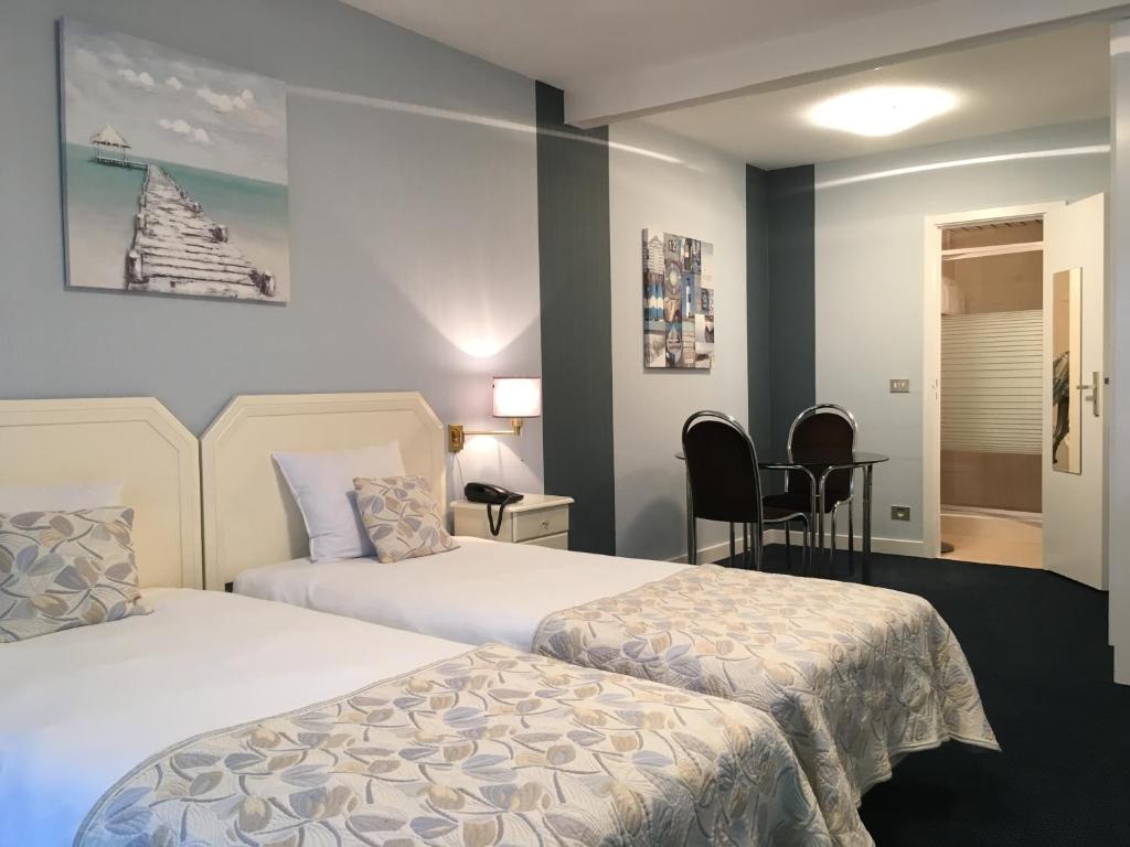 Postel nebo postele na pokoji v ubytování First Euroflat Hotel