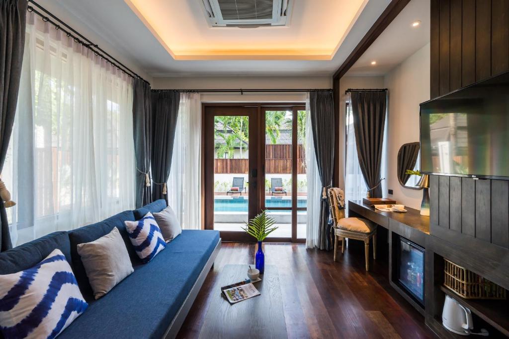 Posezení v ubytování NH Collection Samui Peace Resort