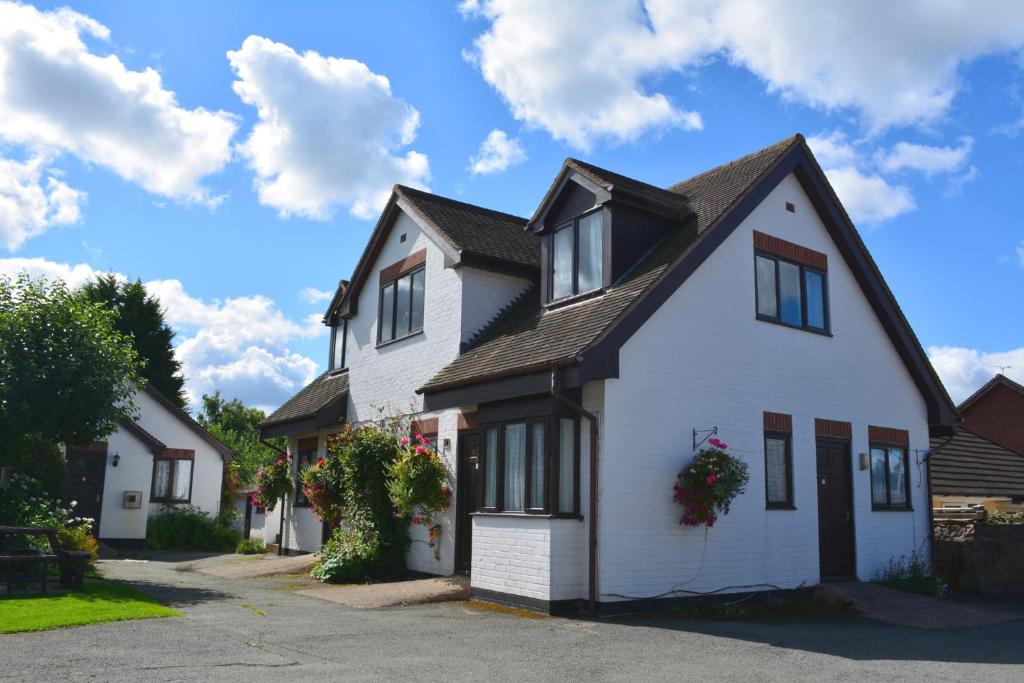 a white house with a black roof at The Bull's Head Inn in Bridgnorth