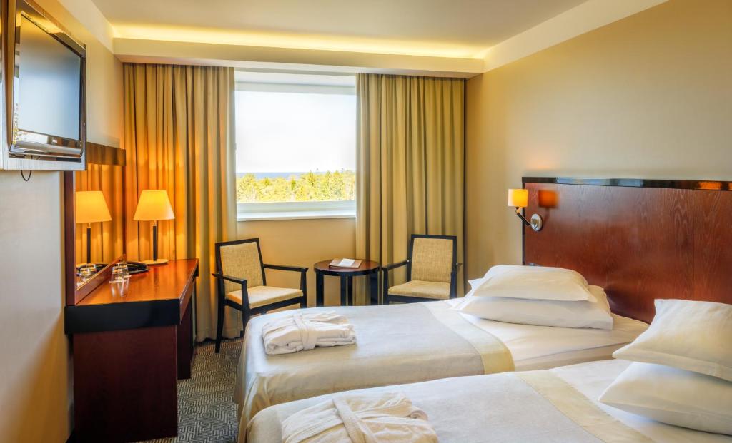 Postel nebo postele na pokoji v ubytování Meresuu Spa & Hotel