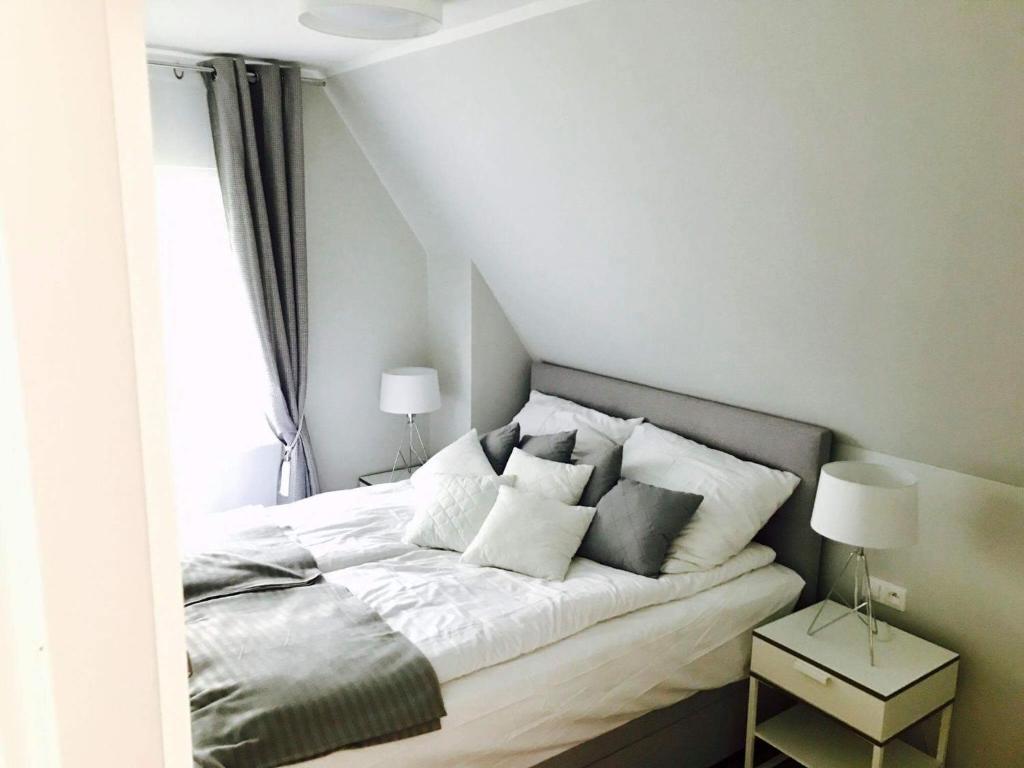 Łóżko lub łóżka w pokoju w obiekcie Apartamenty Platinum