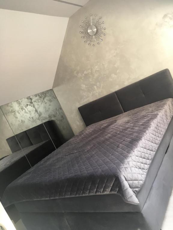 Posteľ alebo postele v izbe v ubytovaní Apartament MnW