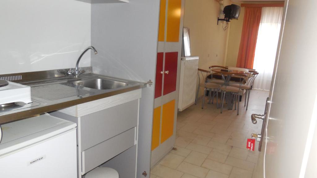 Kuchyň nebo kuchyňský kout v ubytování Hotel Dias Apartment