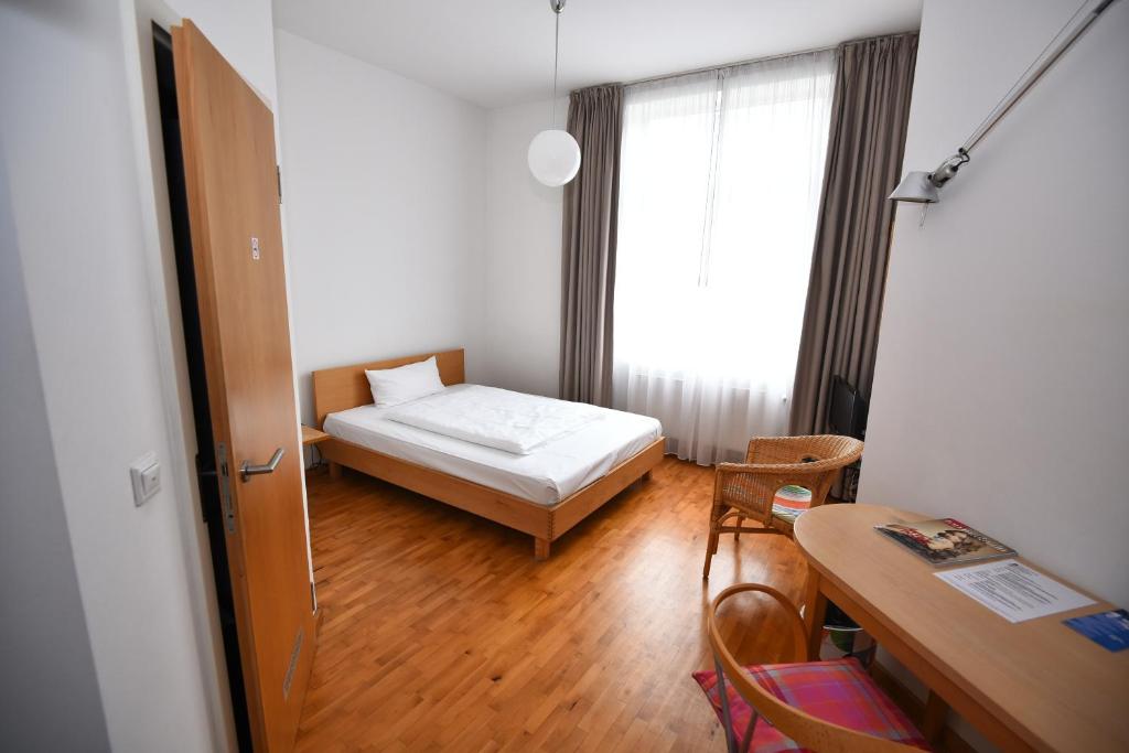 Postel nebo postele na pokoji v ubytování Art-Hotel Robert Mayer