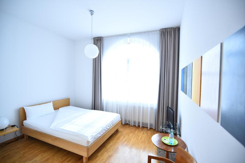 Postel nebo postele na pokoji v ubytování Art-Hotel Robert Mayer