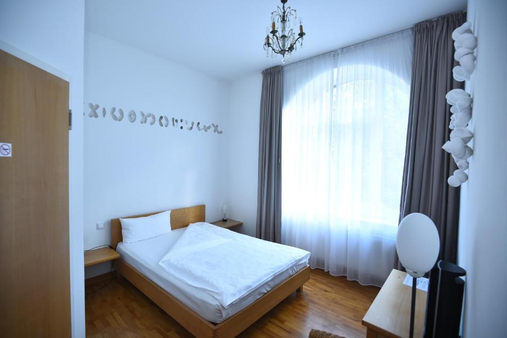 Postel nebo postele na pokoji v ubytování Art-Hotel Robert Mayer