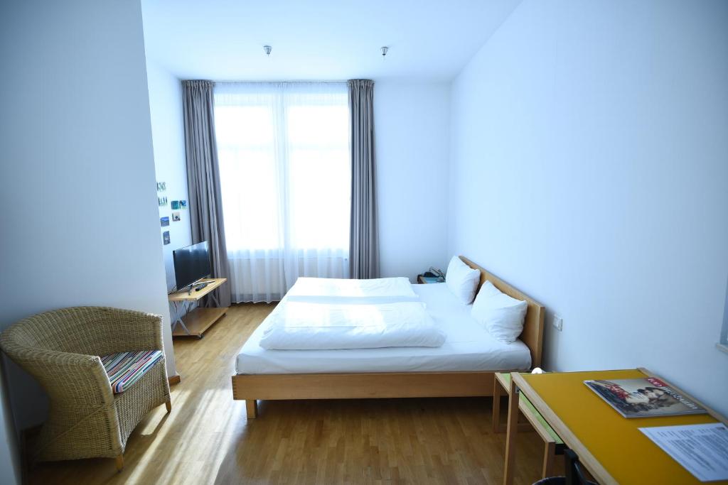 Postel nebo postele na pokoji v ubytování Art-Hotel Robert Mayer
