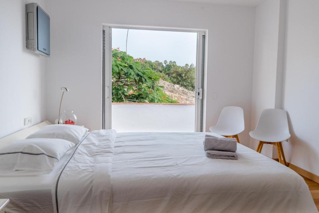 Postel nebo postele na pokoji v ubytování Nice Home Costa Adeje
