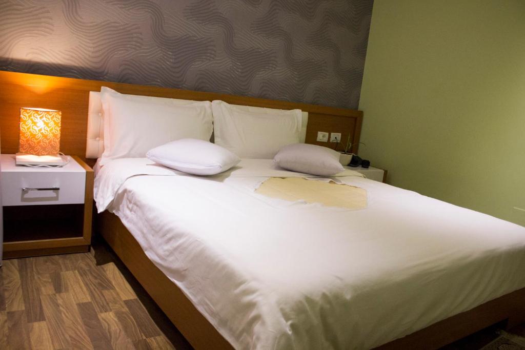 Postel nebo postele na pokoji v ubytování Hotel Bylis