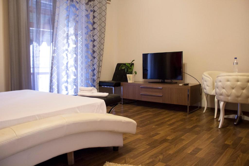 Postel nebo postele na pokoji v ubytování Hotel Bylis