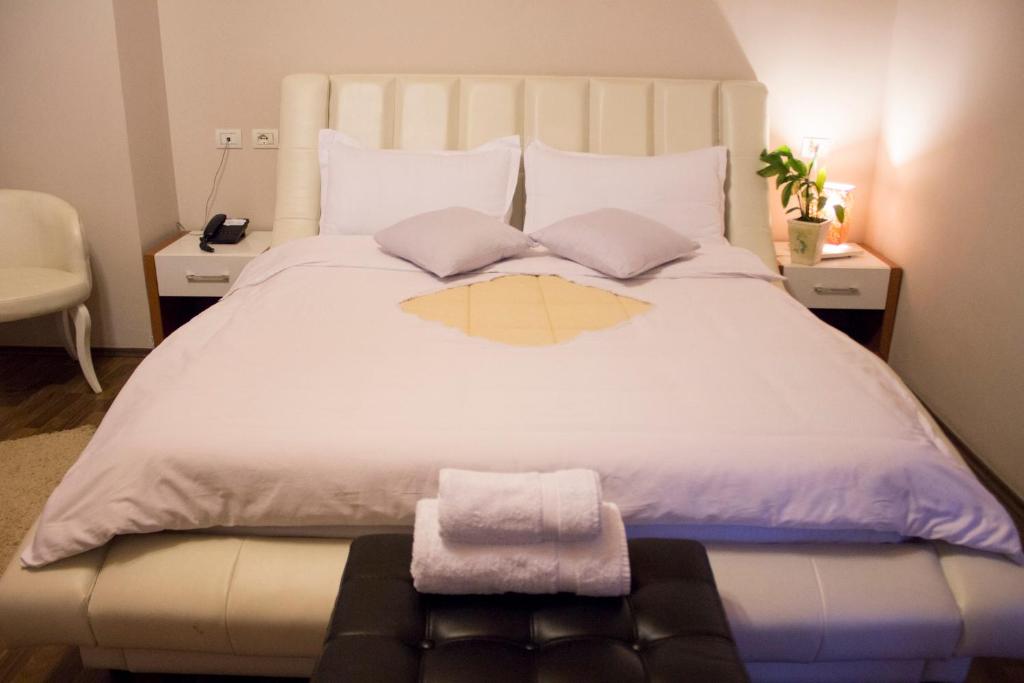 Postel nebo postele na pokoji v ubytování Hotel Bylis