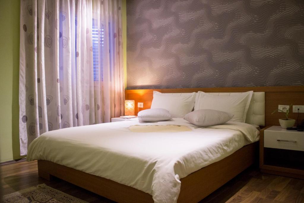 Postel nebo postele na pokoji v ubytování Hotel Bylis
