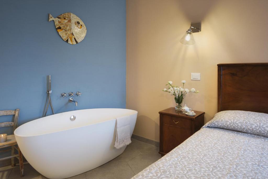 Postel nebo postele na pokoji v ubytování La Bellavita B&B