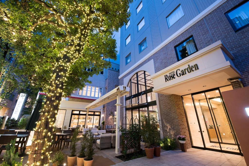 a view of the front of a cafe called pine garden at Hotel Rose Garden Shinjuku in Tokyo