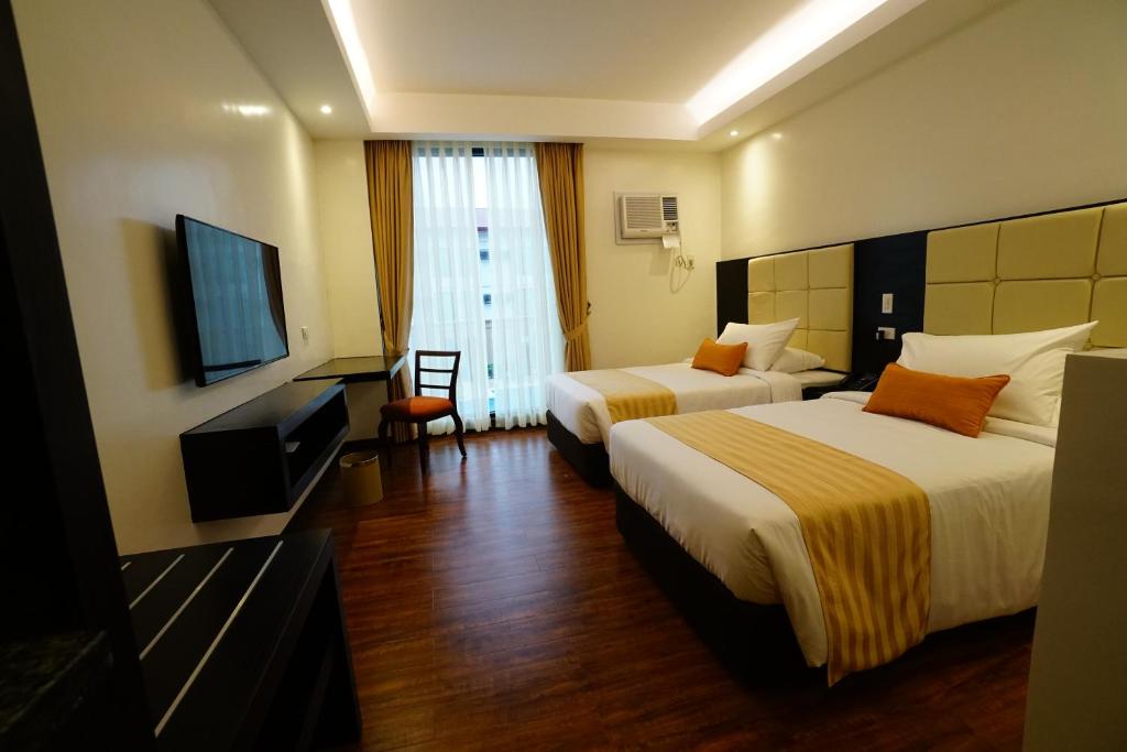 TV a/nebo společenská místnost v ubytování Hotel Oazis