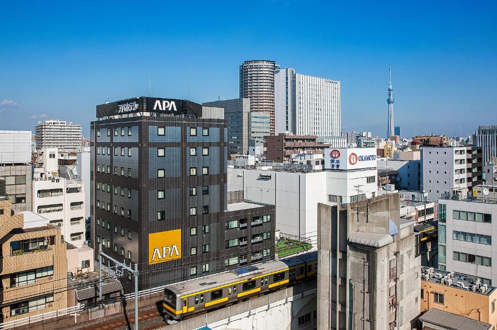 a large city with a train on the tracks at APA Hotel Akihabara-Ekimae in Tokyo