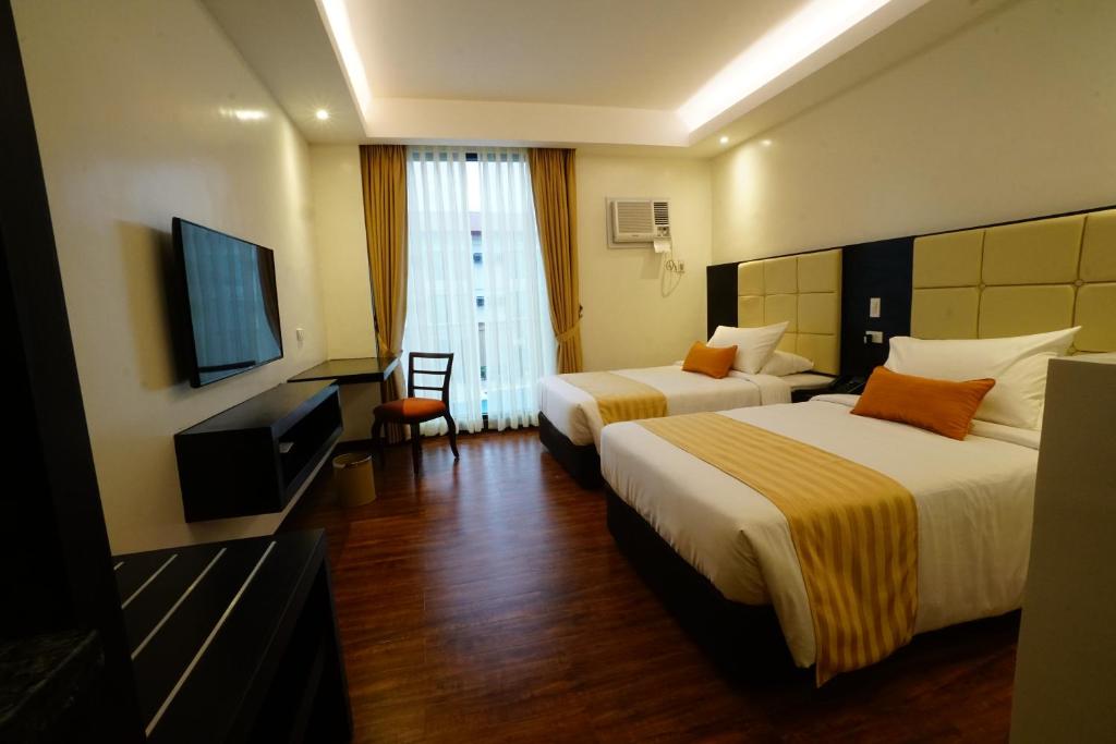 TV a/nebo společenská místnost v ubytování Hotel Oazis