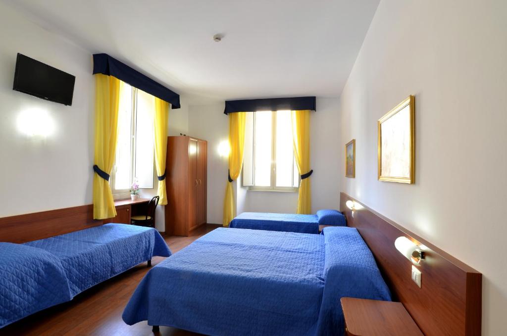 Postel nebo postele na pokoji v ubytování Hotel Tex