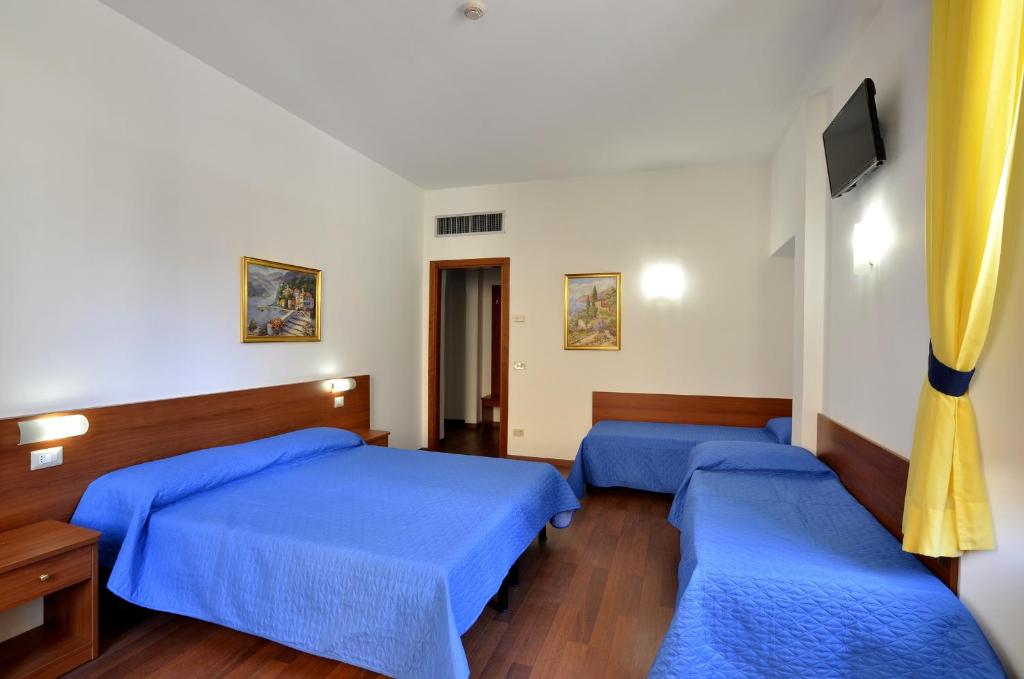 Postel nebo postele na pokoji v ubytování Hotel Tex