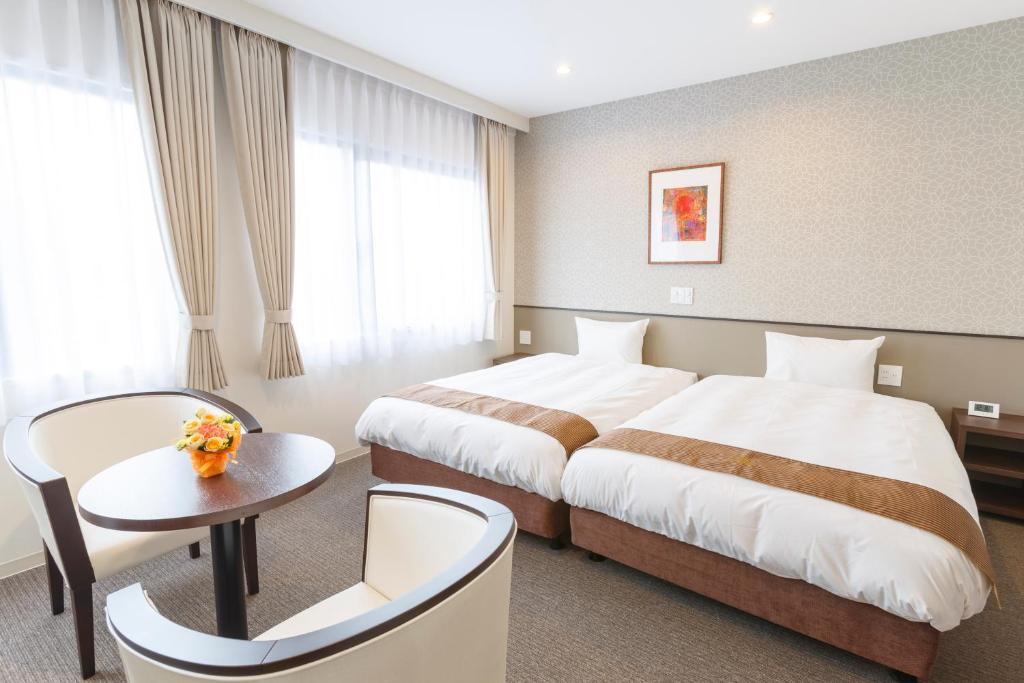 Postel nebo postele na pokoji v ubytování Hotel Amabile Maizuru