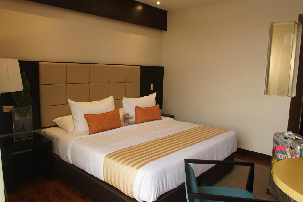 Postel nebo postele na pokoji v ubytování Hotel Oazis