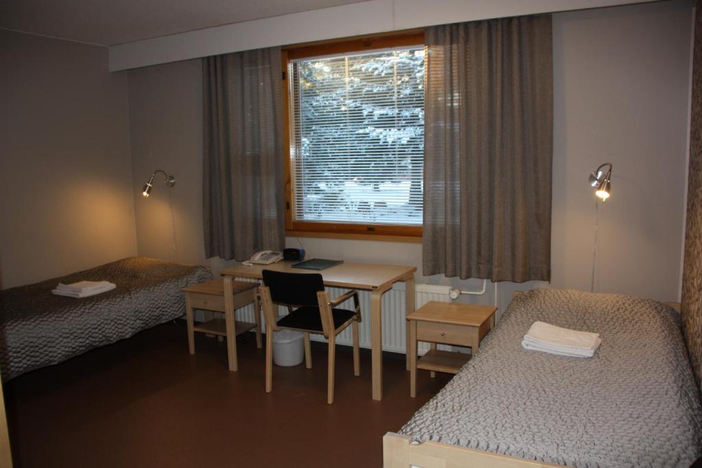 Uma cama ou camas num quarto em Kiipula Guest House