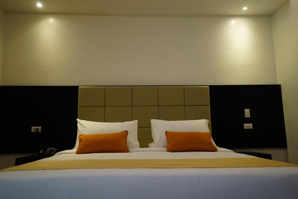 Postel nebo postele na pokoji v ubytování Hotel Oazis