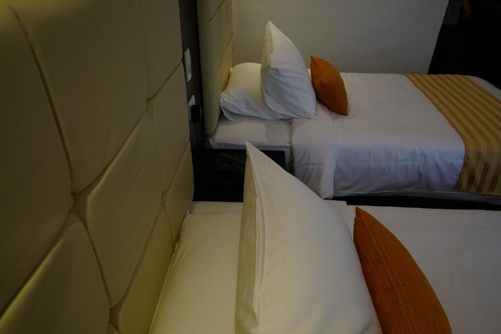 Postel nebo postele na pokoji v ubytování Hotel Oazis