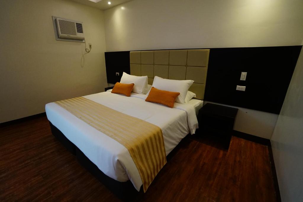 Postel nebo postele na pokoji v ubytování Hotel Oazis