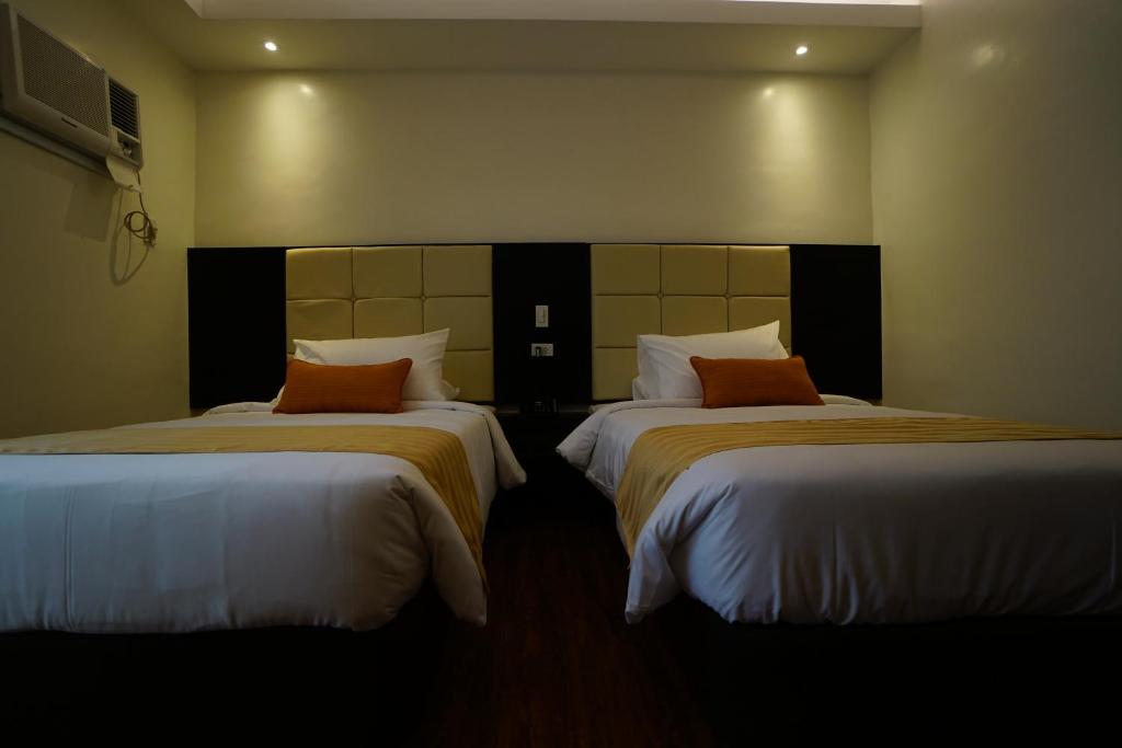 Postel nebo postele na pokoji v ubytování Hotel Oazis