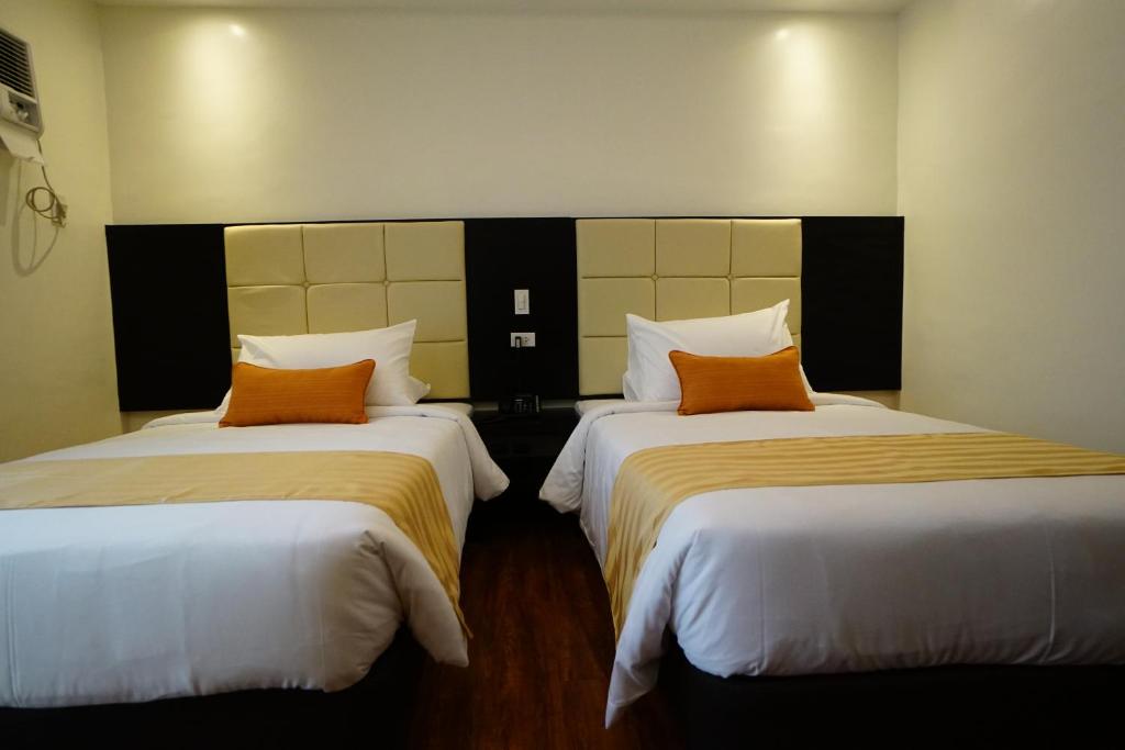 Postel nebo postele na pokoji v ubytování Hotel Oazis