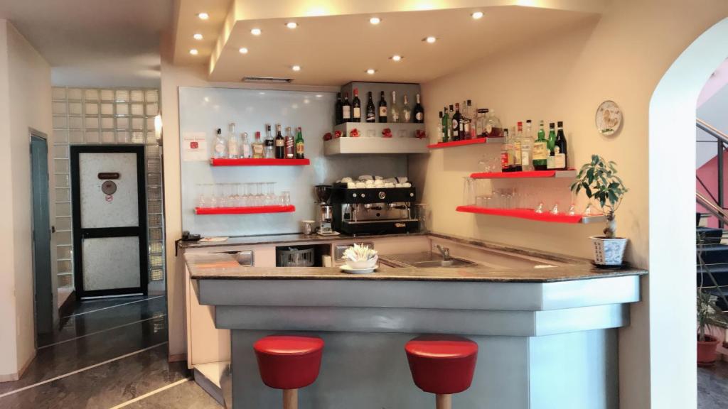 Kuchyň nebo kuchyňský kout v ubytování Hotel Maxim