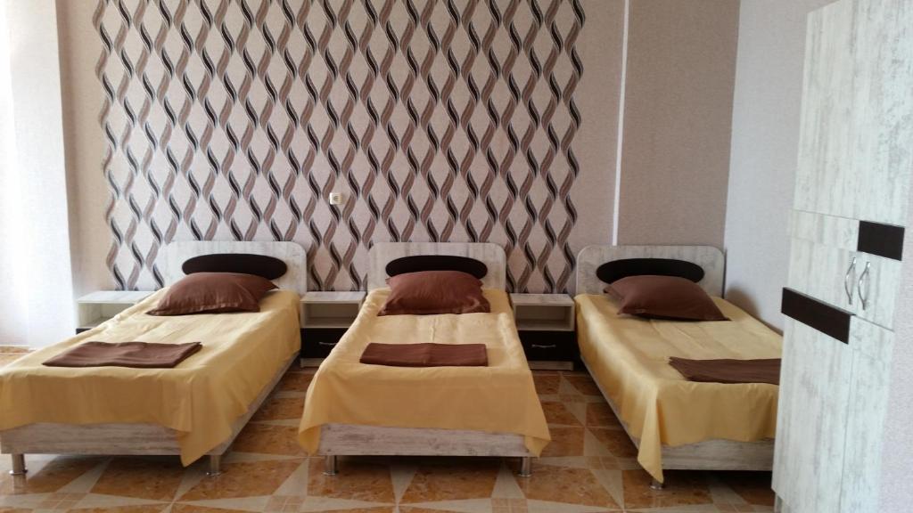Postel nebo postele na pokoji v ubytování Hotel Kvariati Nugo