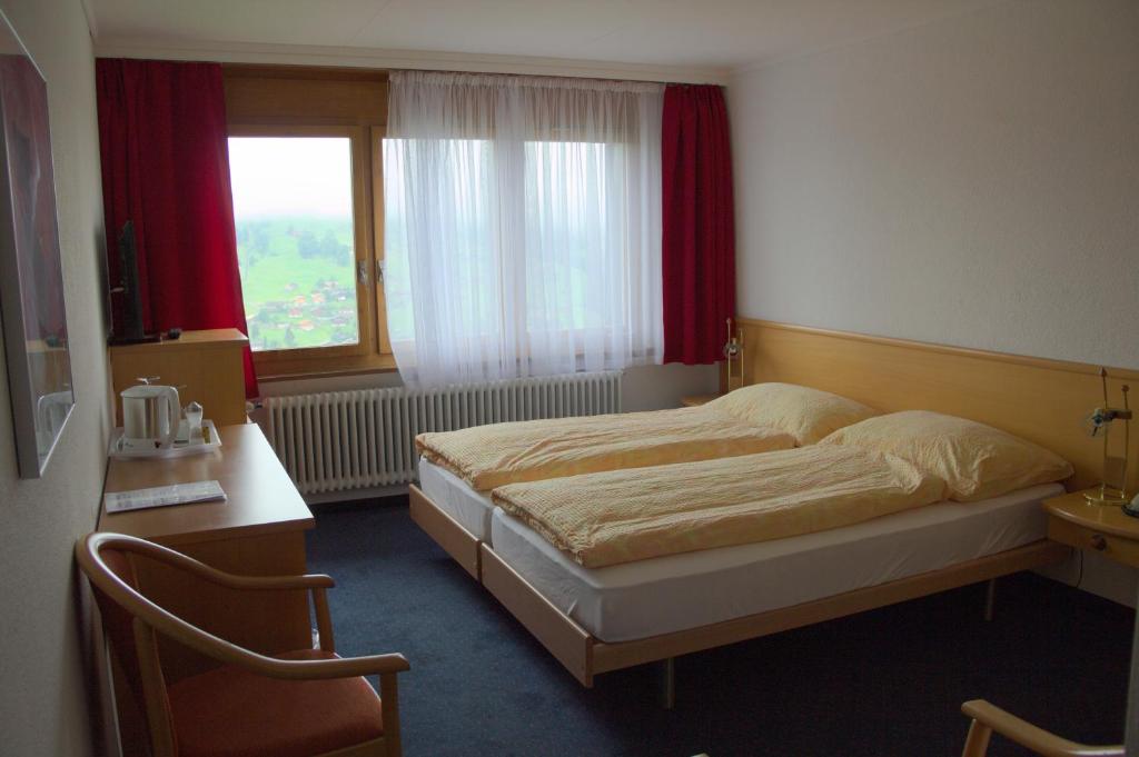 Voodi või voodid majutusasutuse Hotel Eigerblick toas