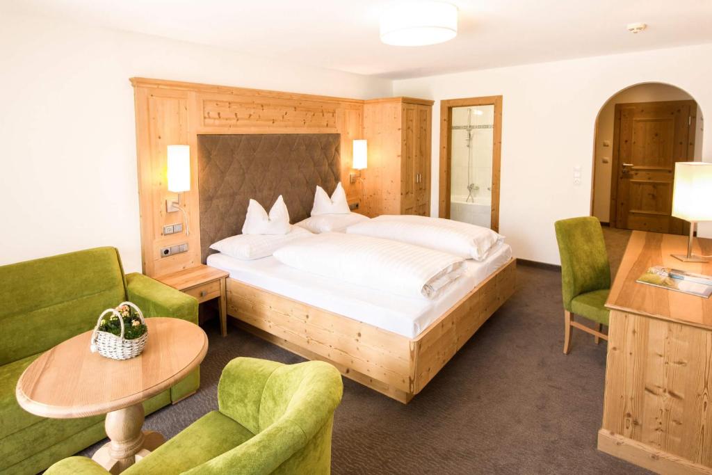 Postel nebo postele na pokoji v ubytování Hotel Pension Sonnleiten