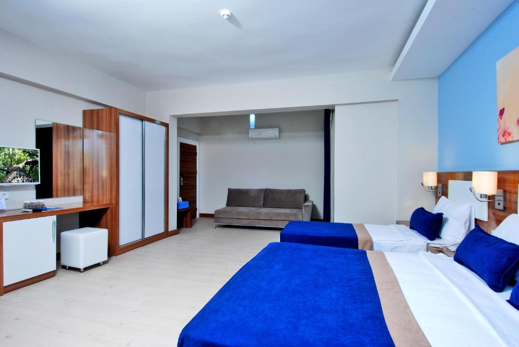 Postel nebo postele na pokoji v ubytování Kleopatra Ramira Hotel - All Inclusive