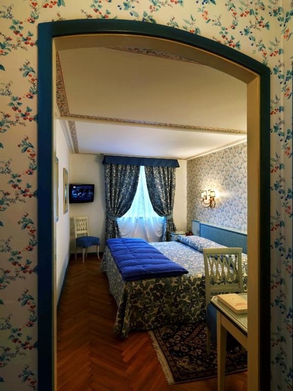 Кровать или кровати в номере Hotel De La Poste