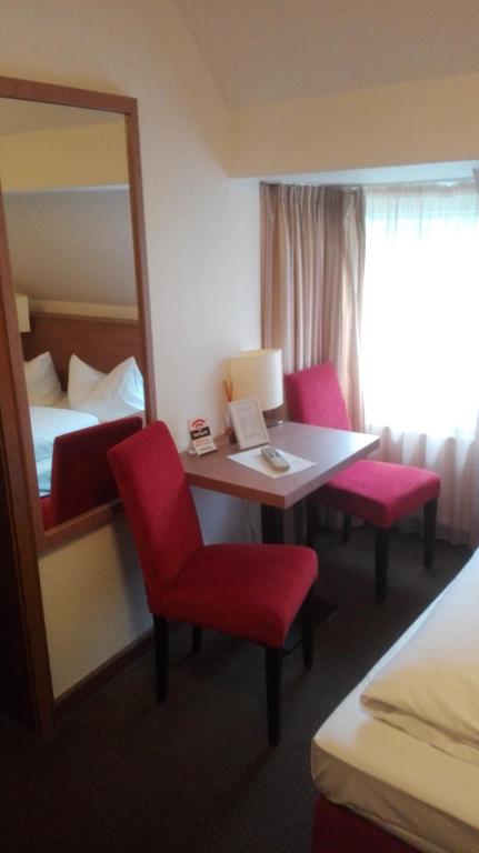 Postel nebo postele na pokoji v ubytování Hotel Fährhaus Ziehl