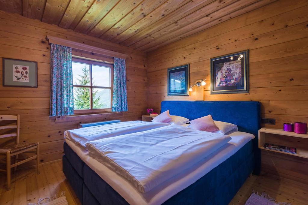 Posteľ alebo postele v izbe v ubytovaní Chalets Ebner