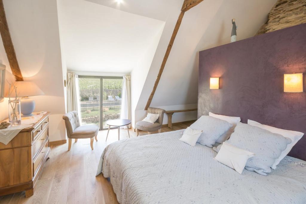 Postel nebo postele na pokoji v ubytování La chambre du Grand Val