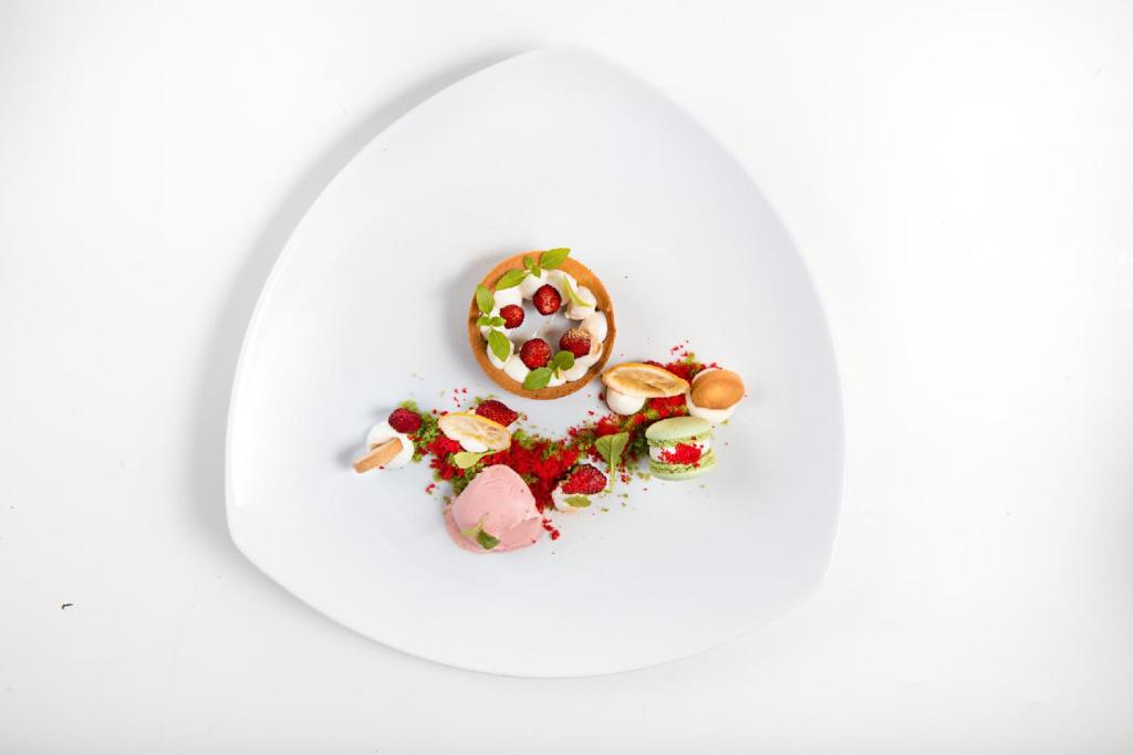 a plate of food with a donut on it at Hotel Villa Gabrisa in Positano