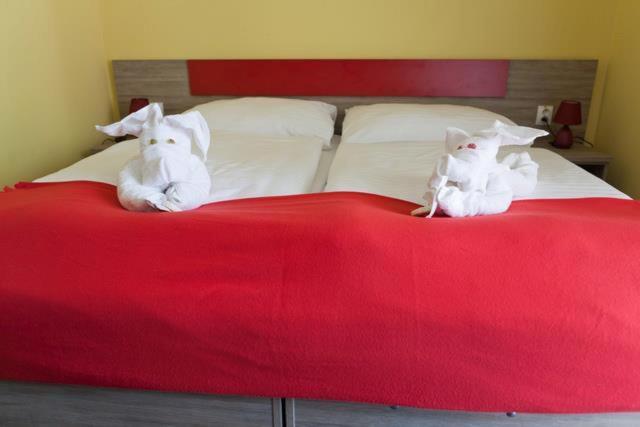 Postel nebo postele na pokoji v ubytování F - Team Hotel