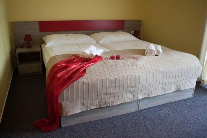 Postel nebo postele na pokoji v ubytování F - Team Hotel
