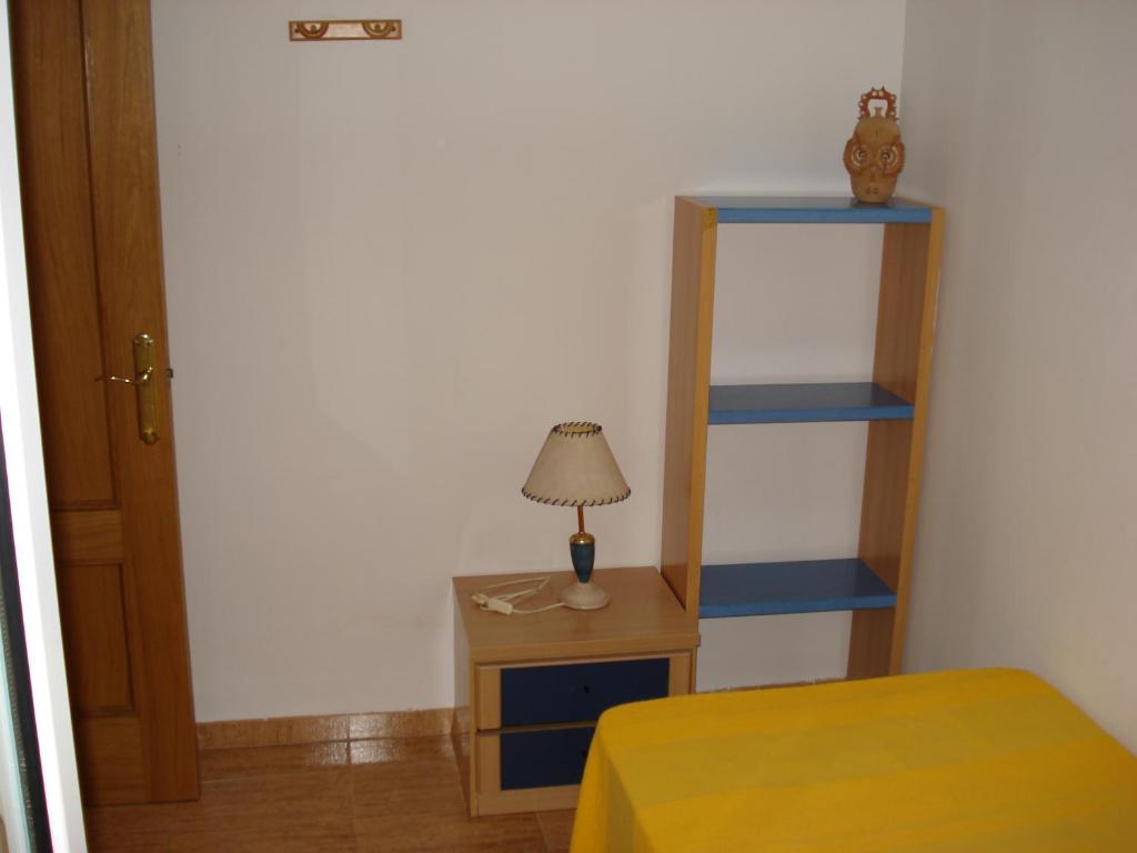 Posteľ alebo postele v izbe v ubytovaní Apartamento Columbretes