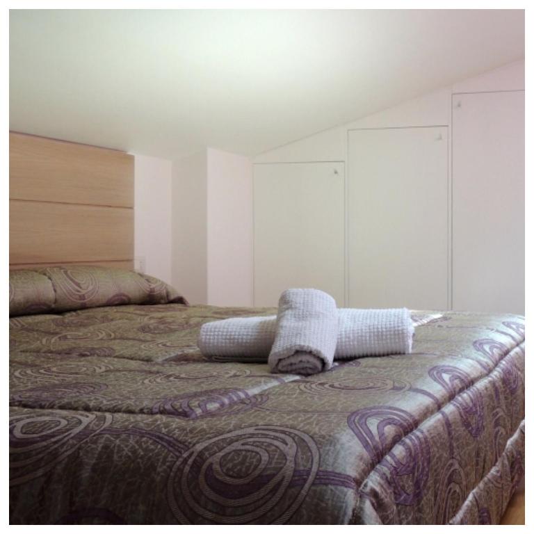 Postel nebo postele na pokoji v ubytování B&B Melanella