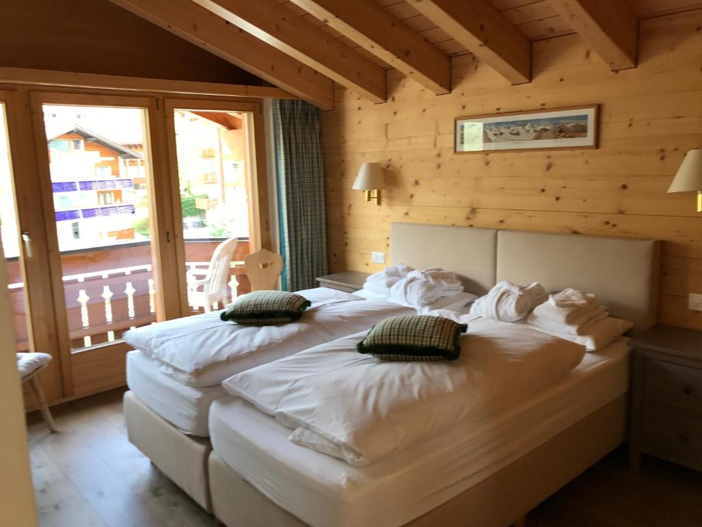 Postel nebo postele na pokoji v ubytování Chalet Guggenbiel